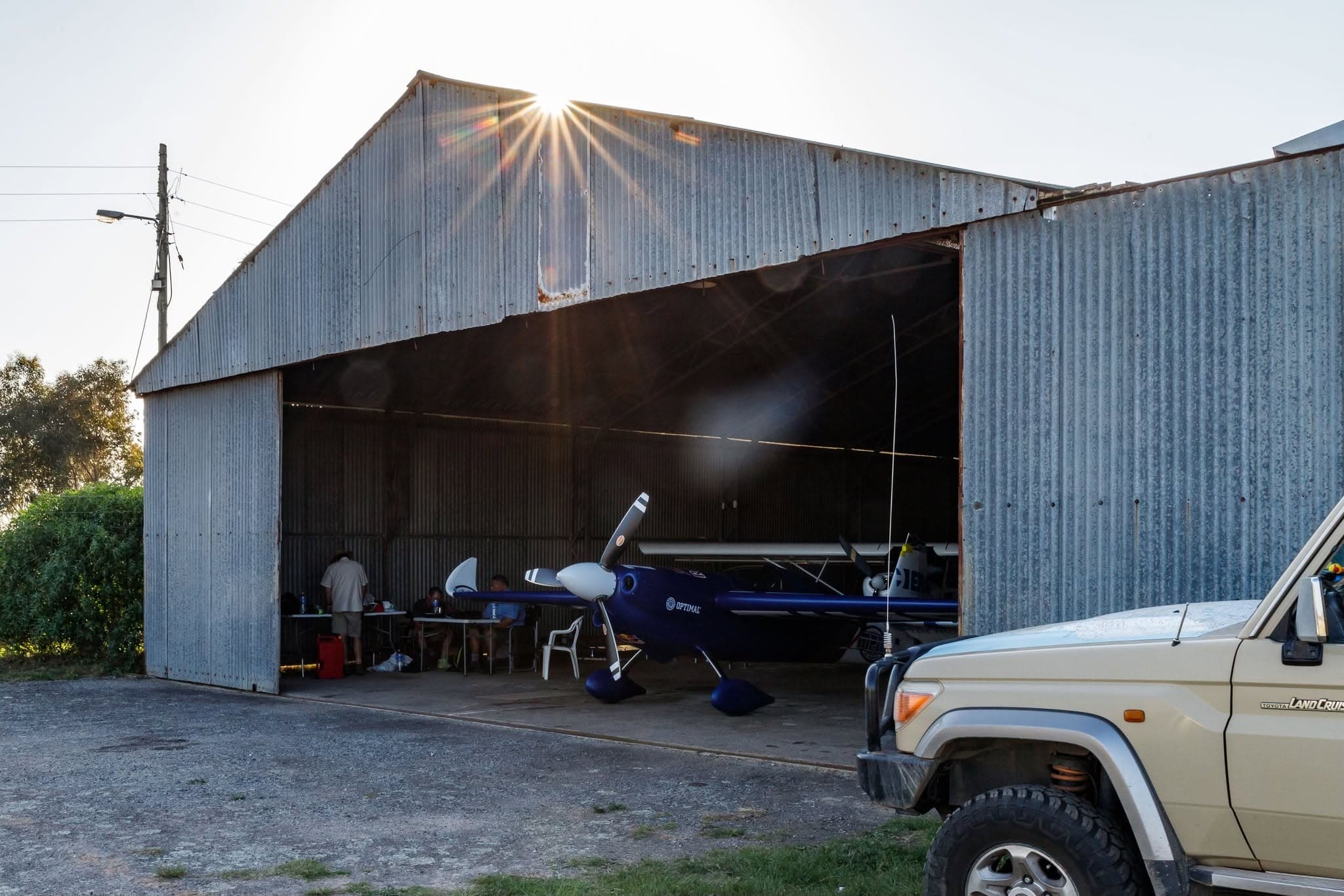 Team 77 hangar at sunset
