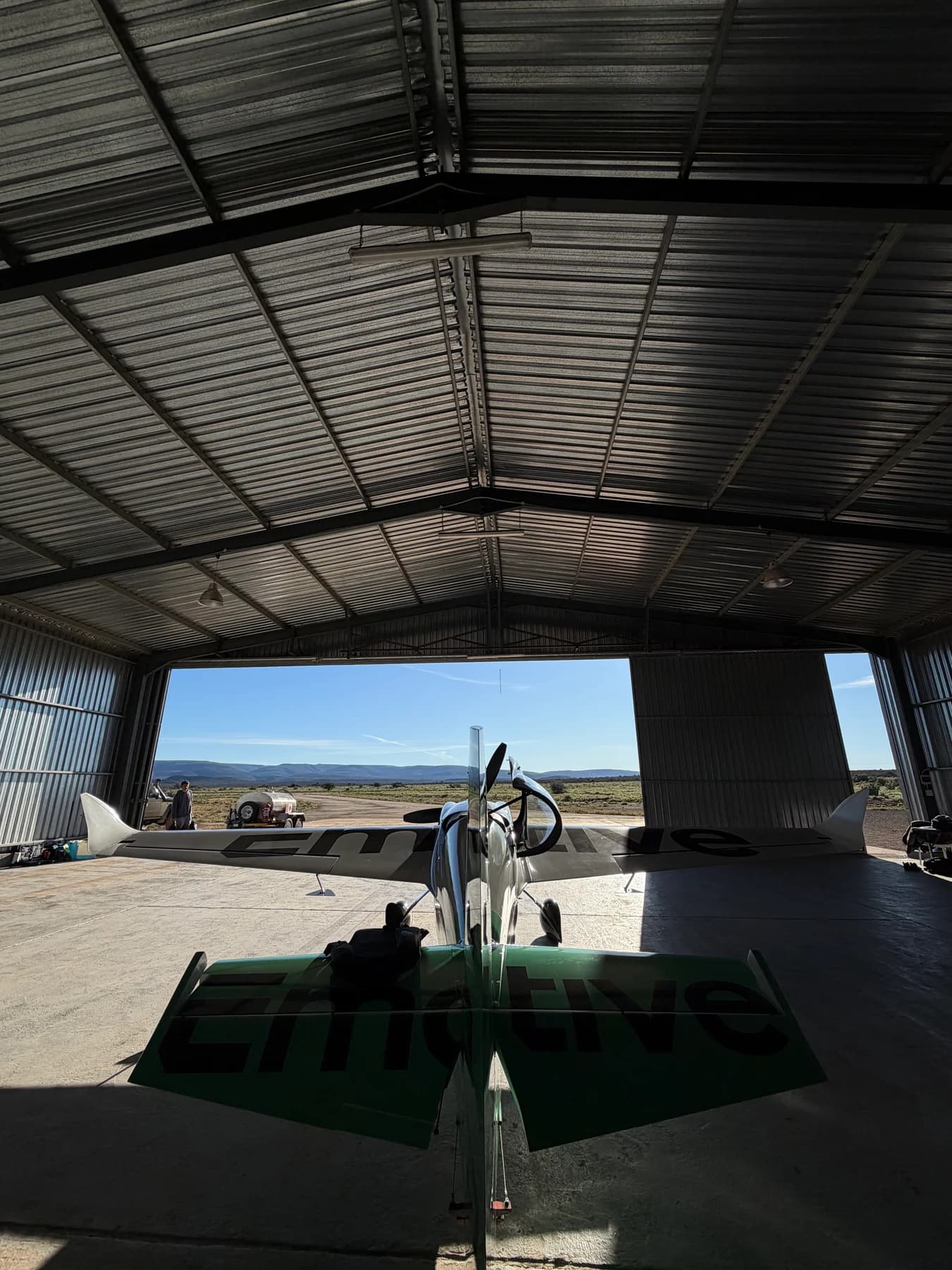 Rear view of the Edge 540 in the hangar looking out over the Karoo