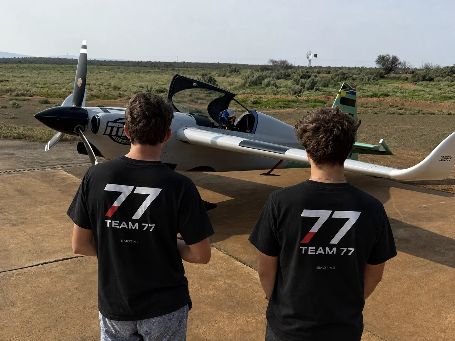 Team 77 supporters wearing Flying Davidson merchandise beside the aircraft